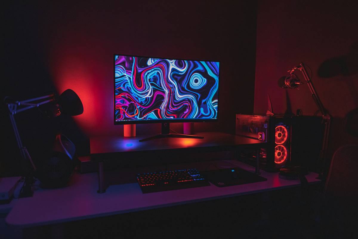 Cozy gaming room ideas with bed using zoned layout and ambient lighting