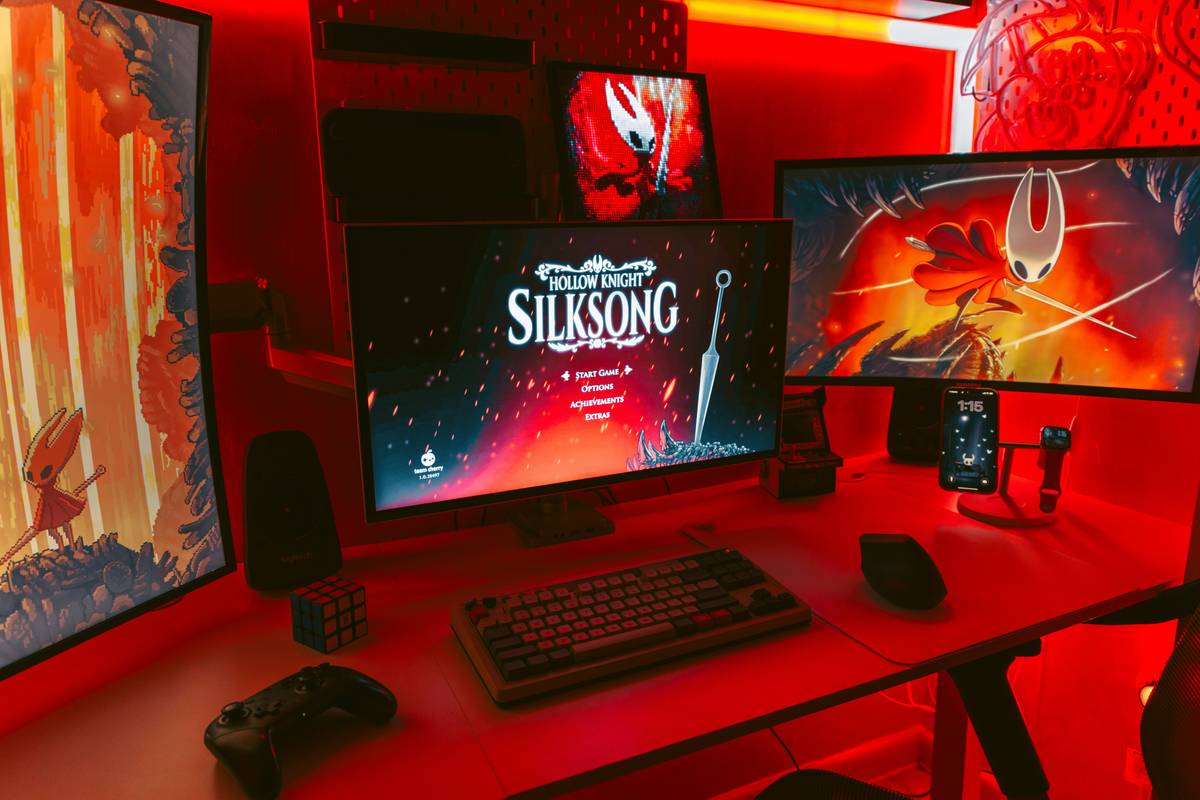 Gaming room with floating bed featuring ergonomic setup and integrated tech