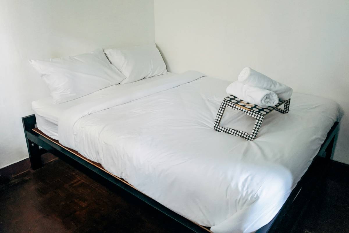 A sleek gaming full size beds setup with RGB lighting, built-in shelves, and cable management